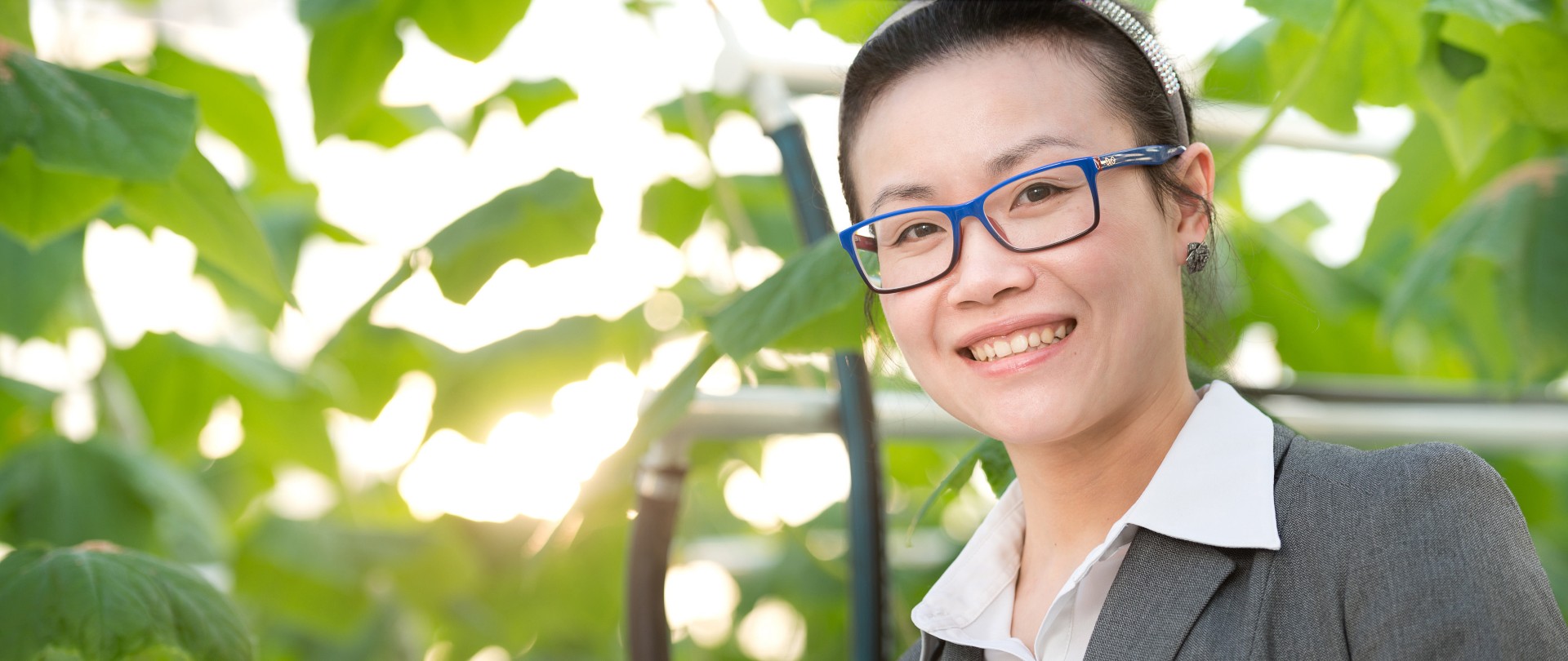 Didi Qian portrait picture in a greenhouse