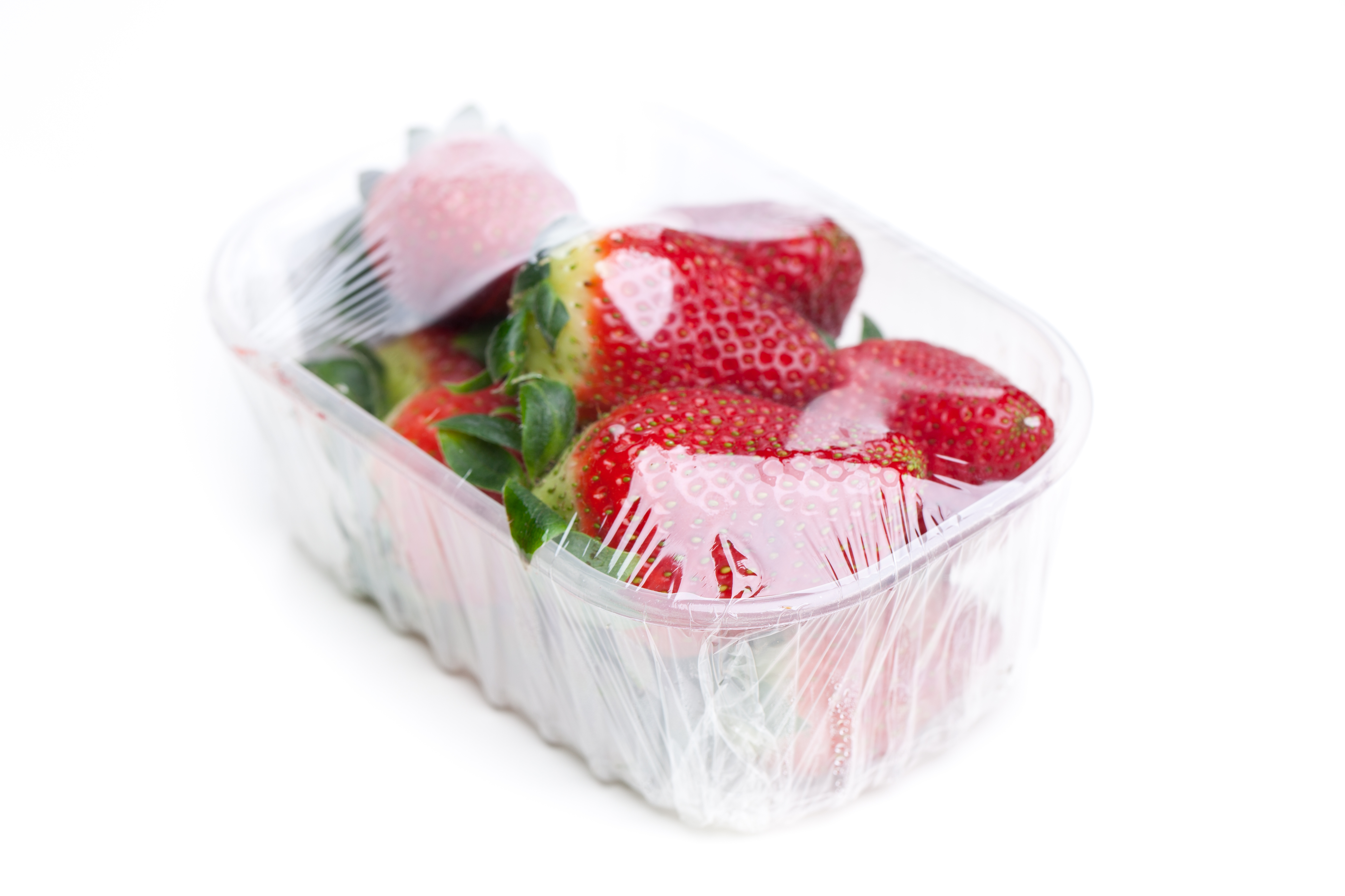 Plastic container with strawberries