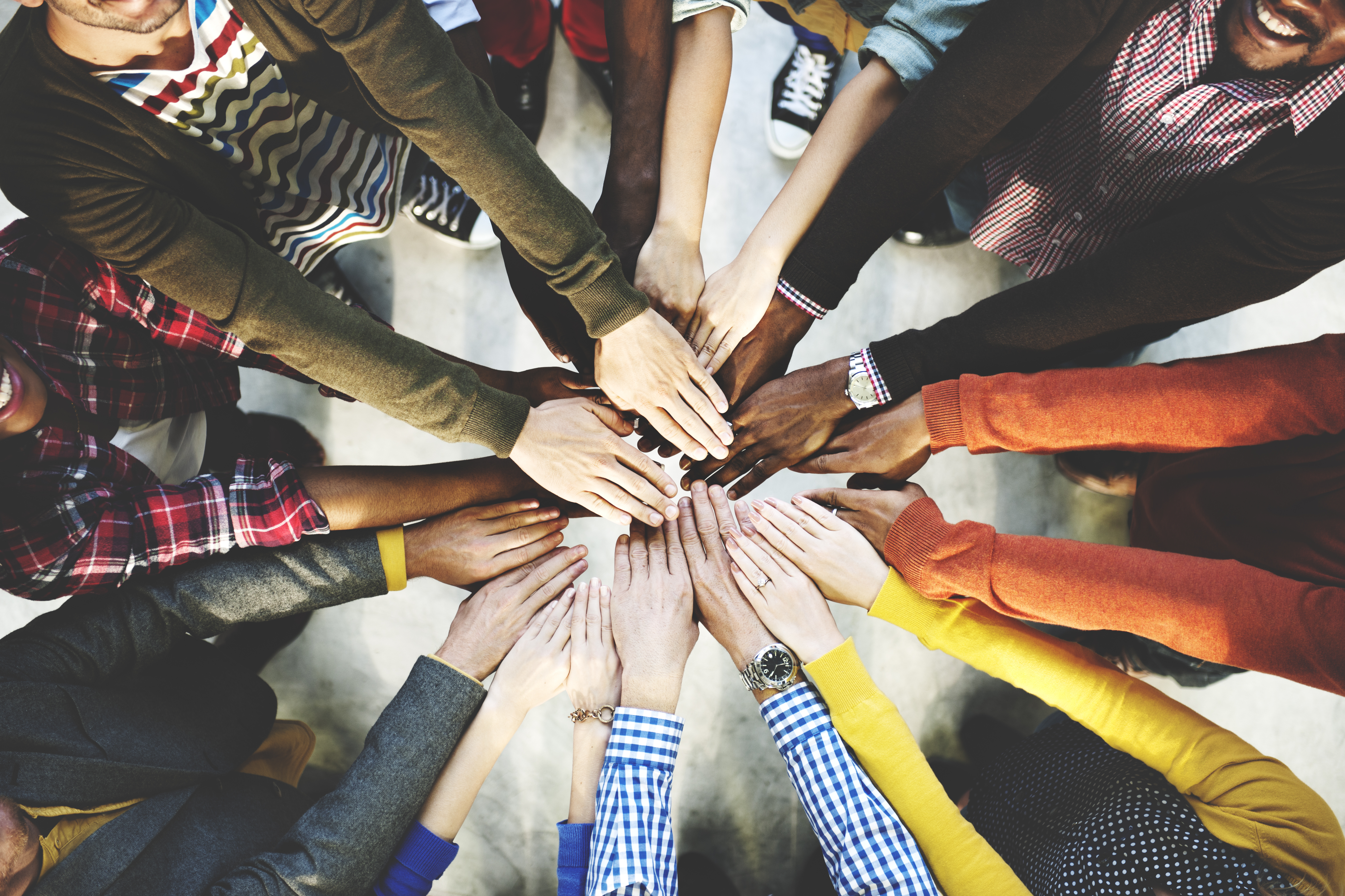 Diverse hands together