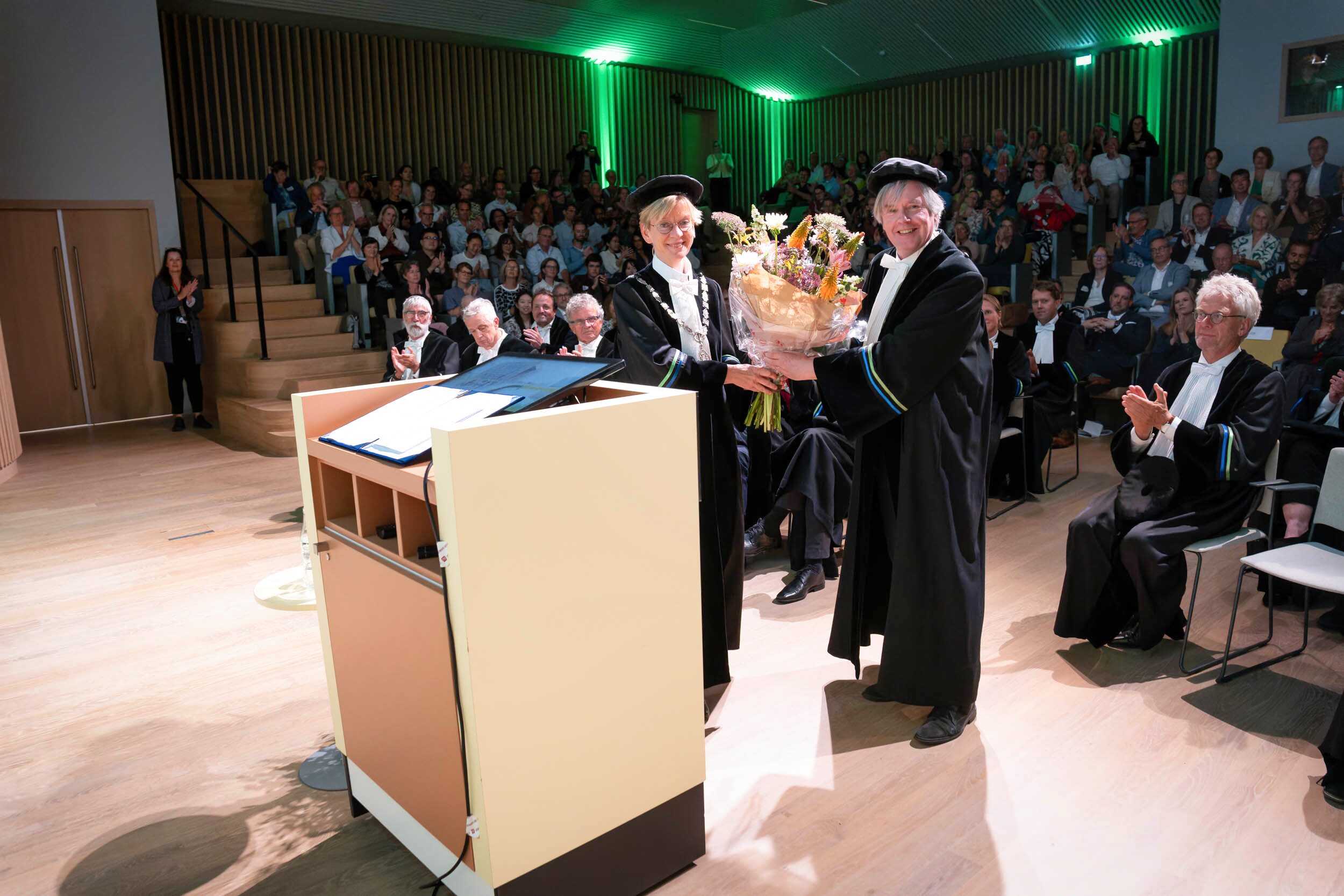 Flowers are being given to the presentors