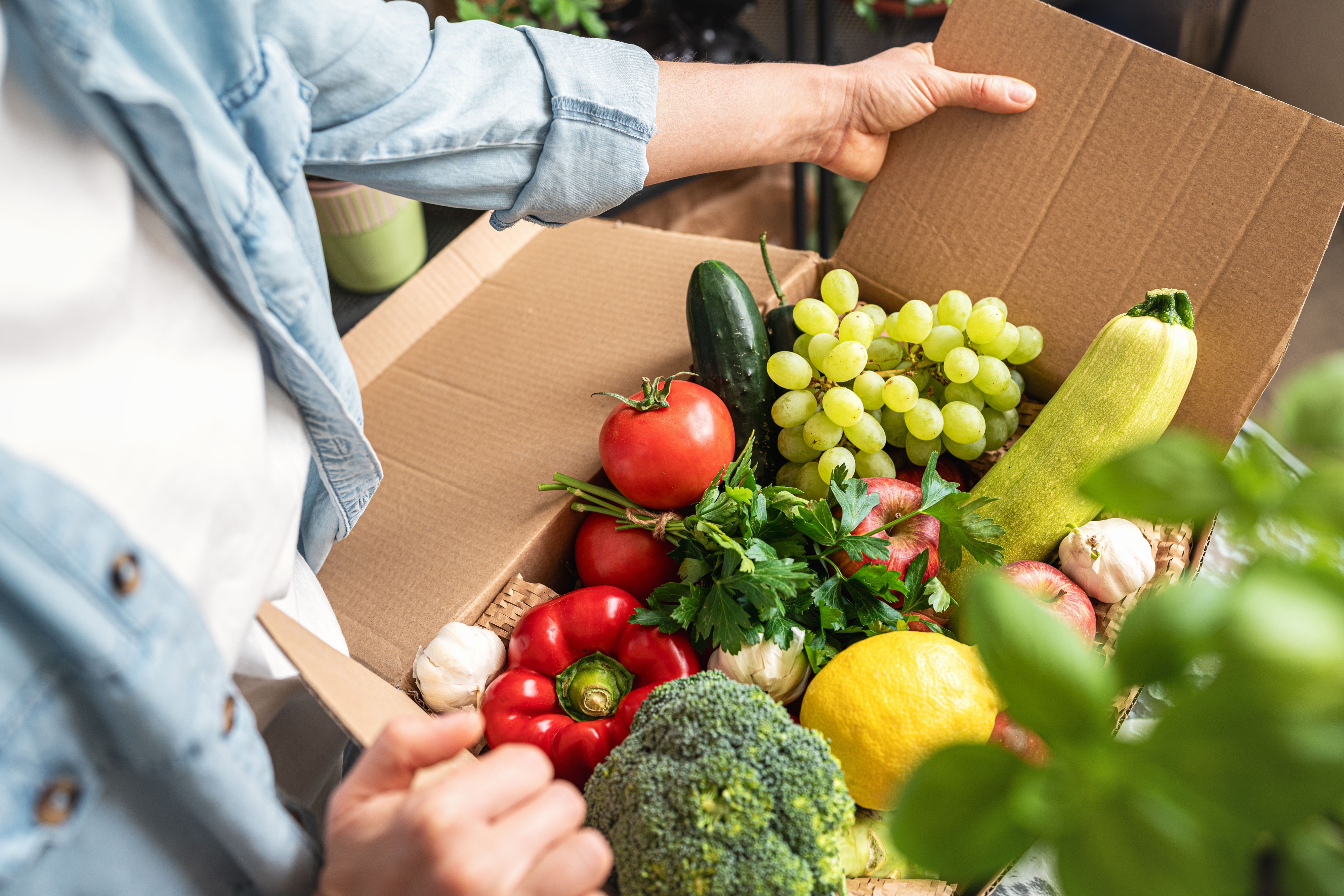 Fresh fruits and vegetables in a carton box