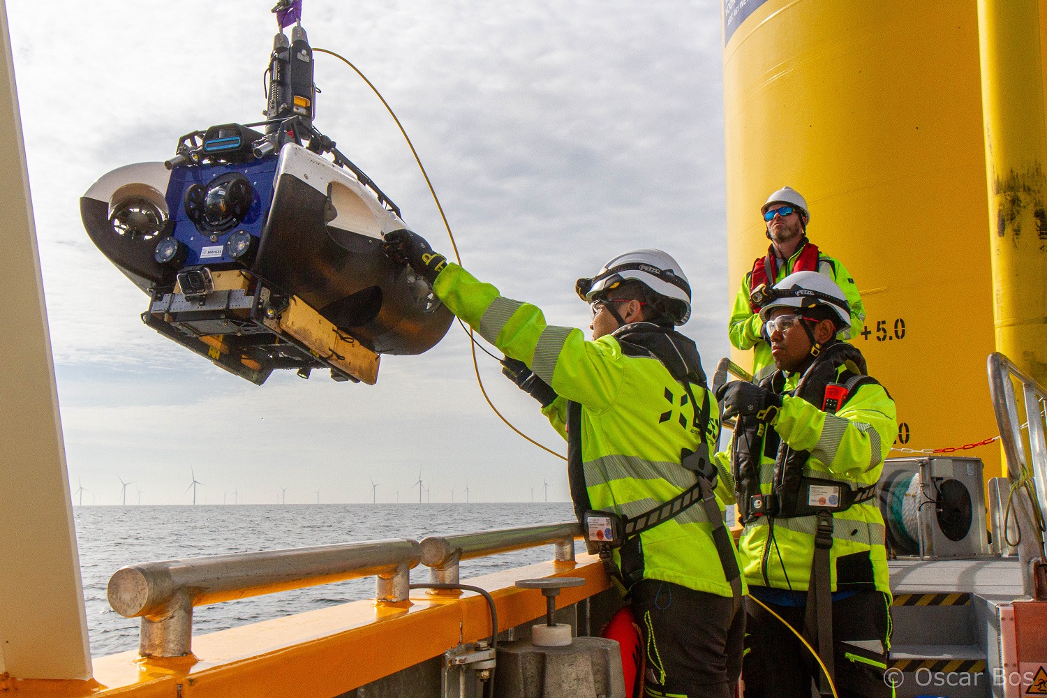 Researchers with underwater drone