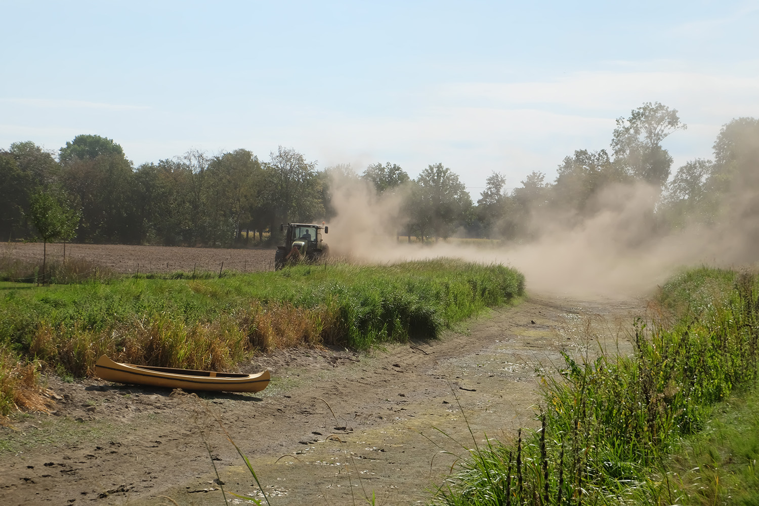 Tractor in dry agricultural field