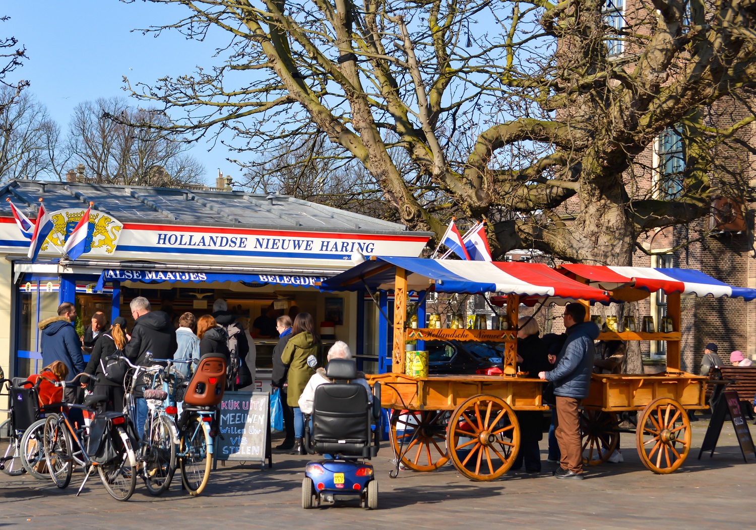 A fish market with stalls selling Dutch herring