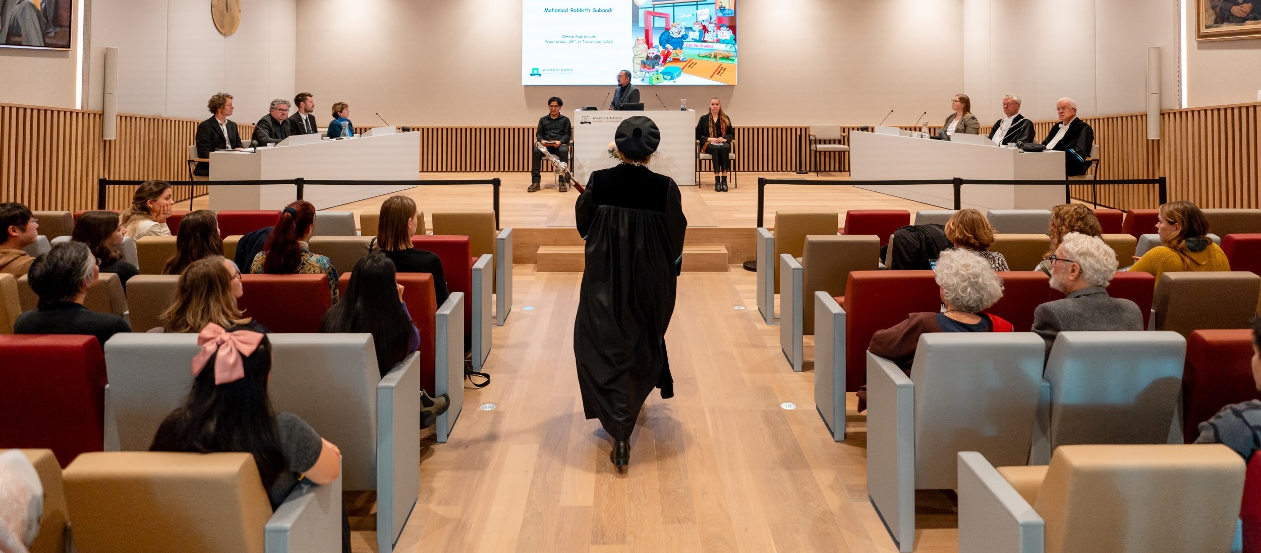 An audience waiting for the start of a PhD defence