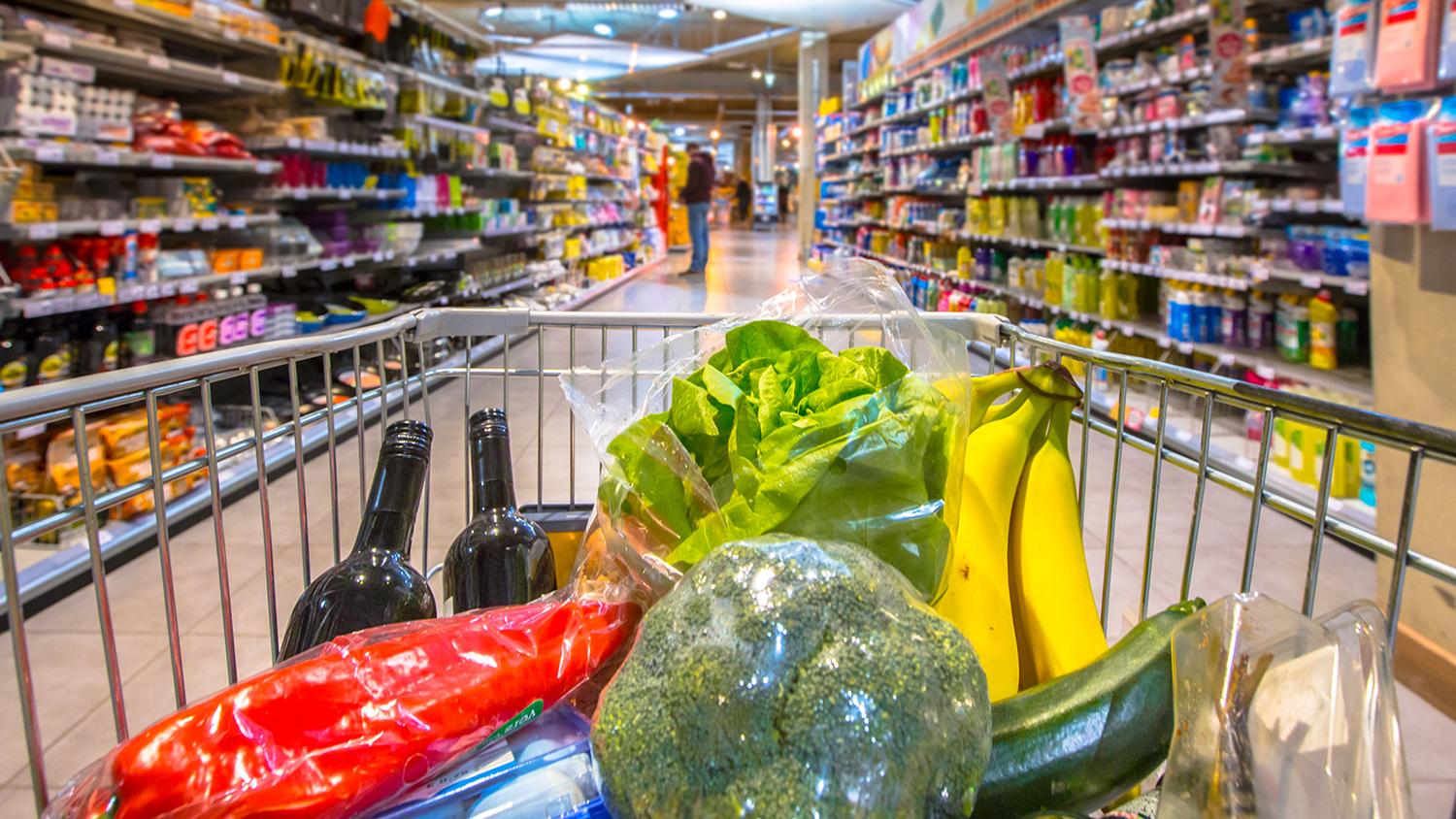 Shopping cart full of groceries.