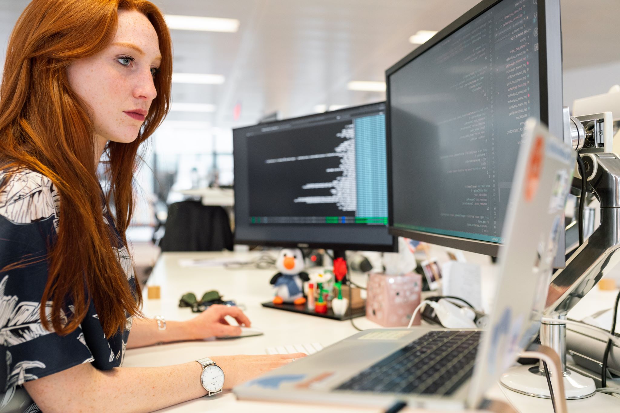 Woman at a desk working on a computer