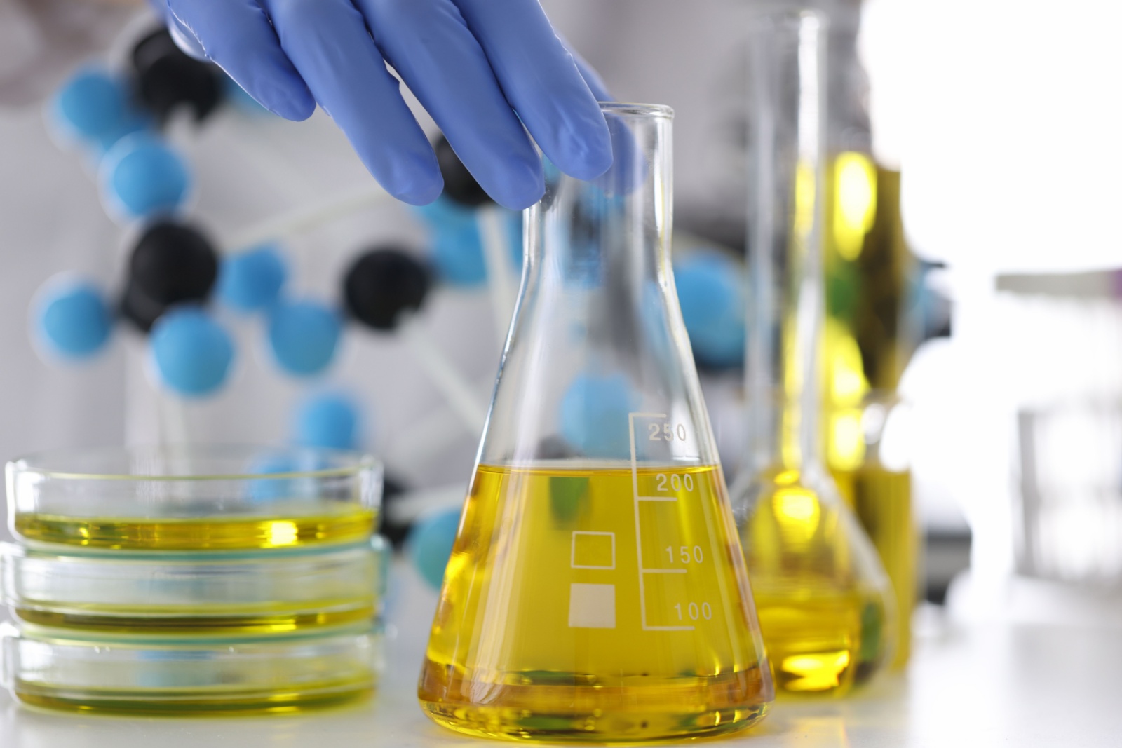 Yellow liquid in chemical laboratory closeup