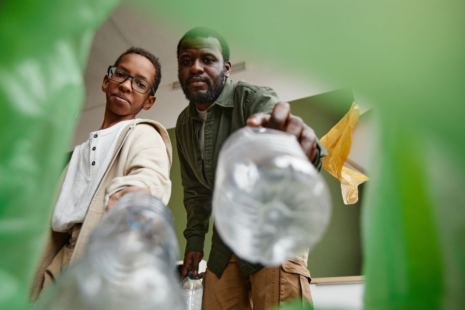 sorting household waste in recycling bin