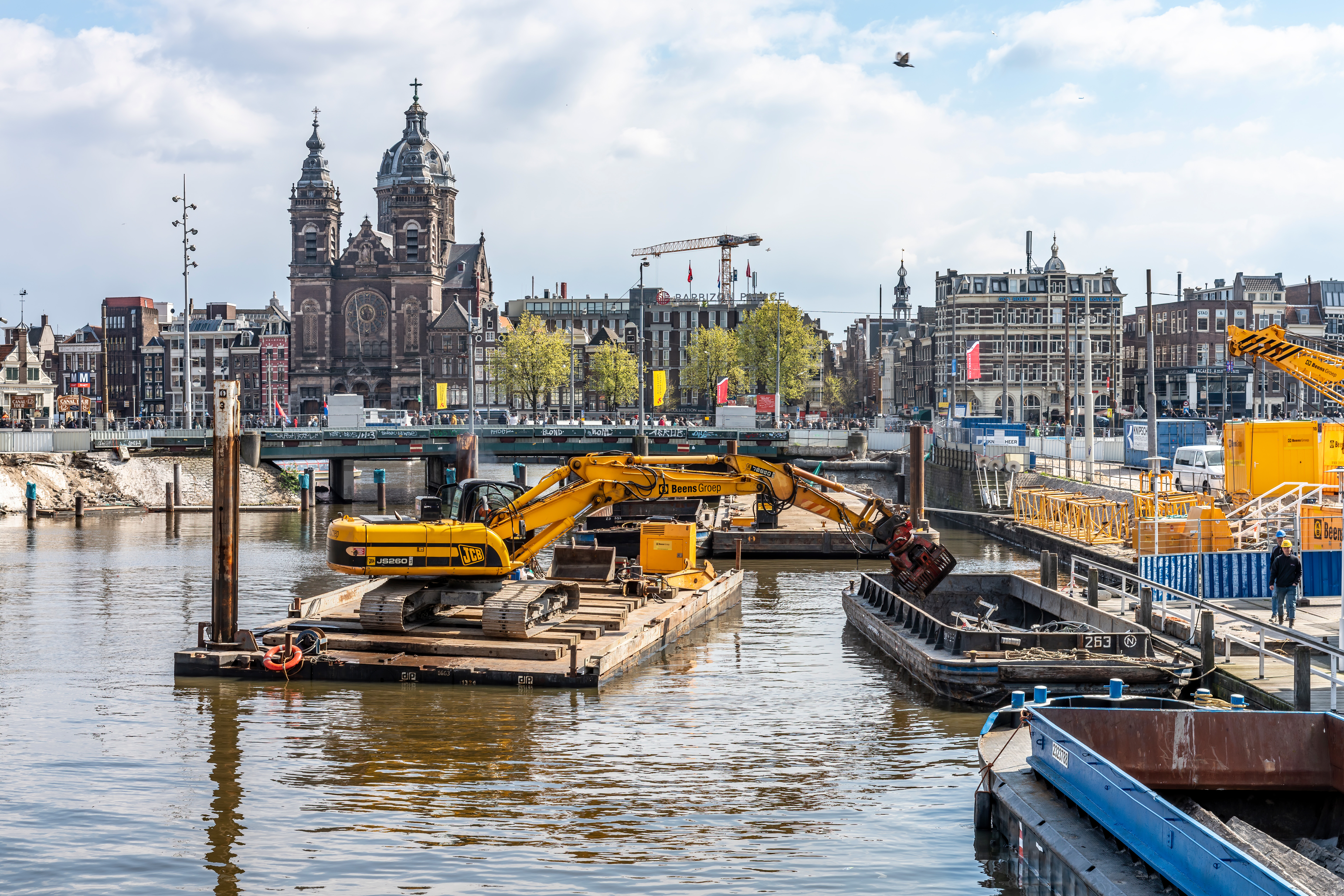 Digger on a raft on the Amstel.
