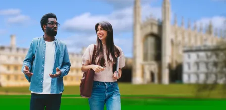 A man and a woman are chatting as they walk across an English university campus