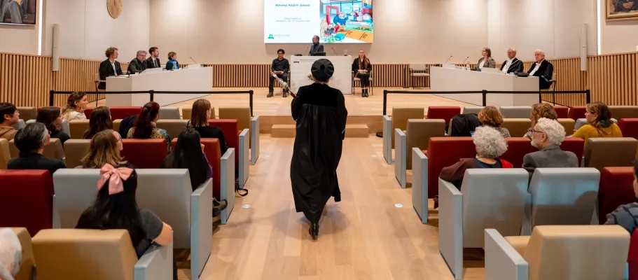 An audience waiting for the start of a PhD defence