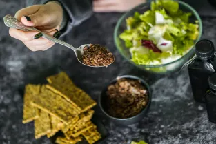 Drizzling organic pumpkin oil and adding gut-friendly seeds