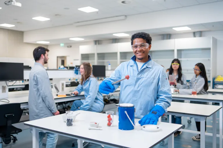 Louis, student Food technology in the lab smiling to the camera