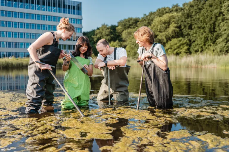 students in the lake on campus