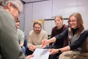 Students and teacher discuss their lab results