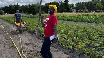 Victoria Alabi out in nature.